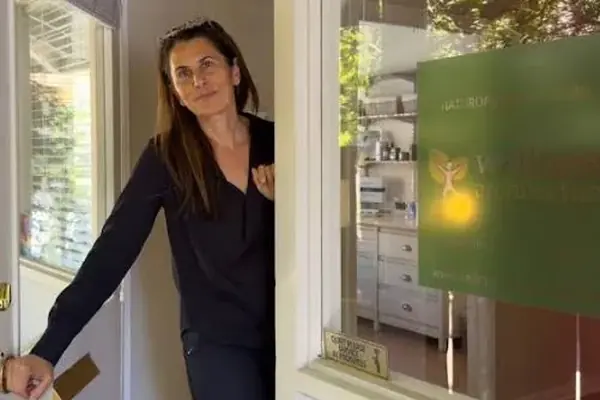 Dr. Samia McCully, ND welcoming a visitor at the door of her Menlo Park office