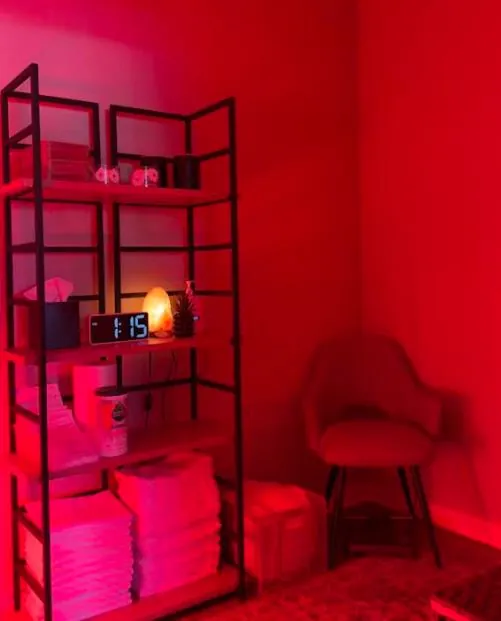 The warm, dimly lit treatment room at Wellness Architecture